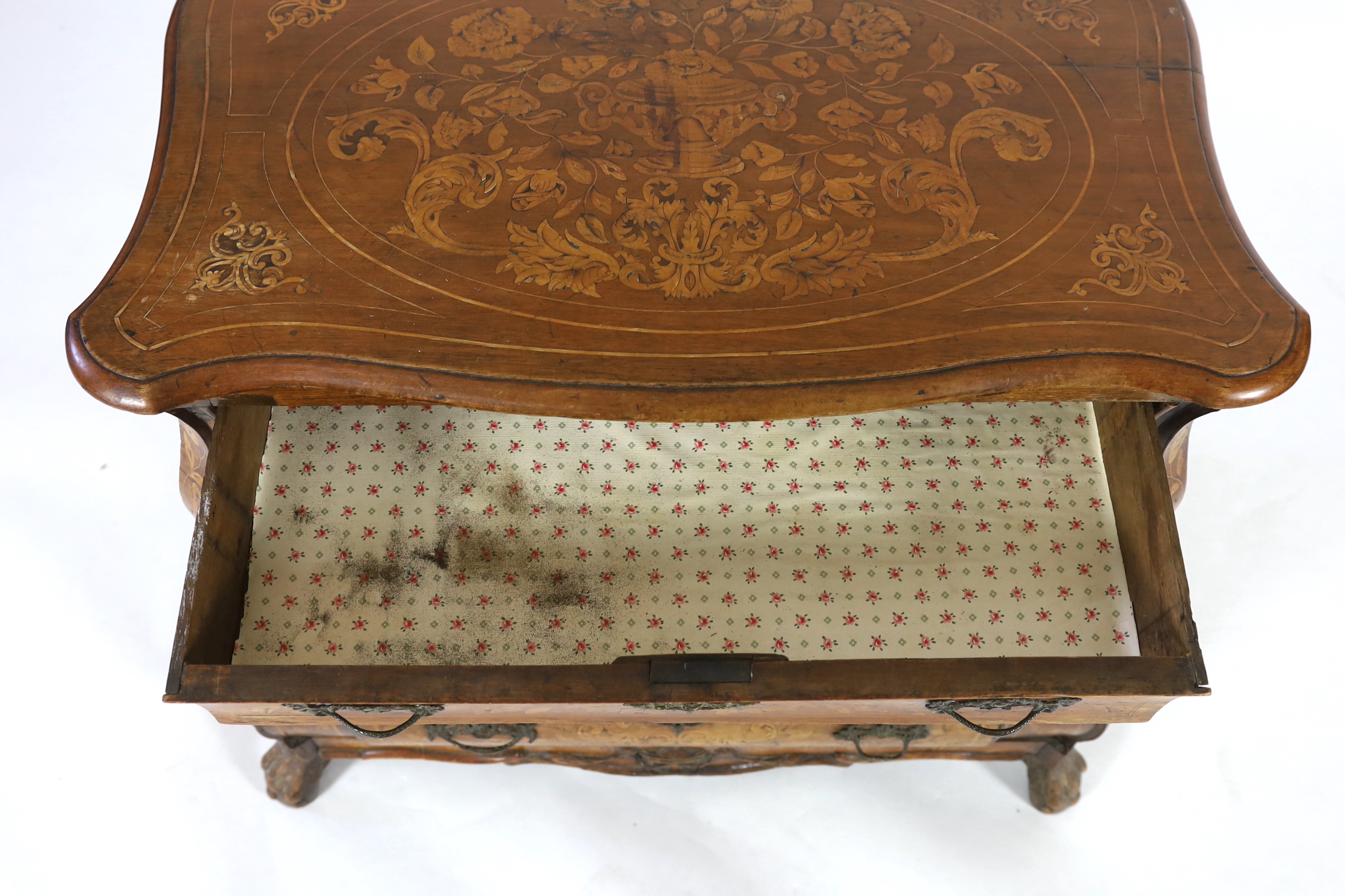 An early 19th century Dutch walnut and marquetry bombé front commode, width 110cm, depth 60cm, height 87cm